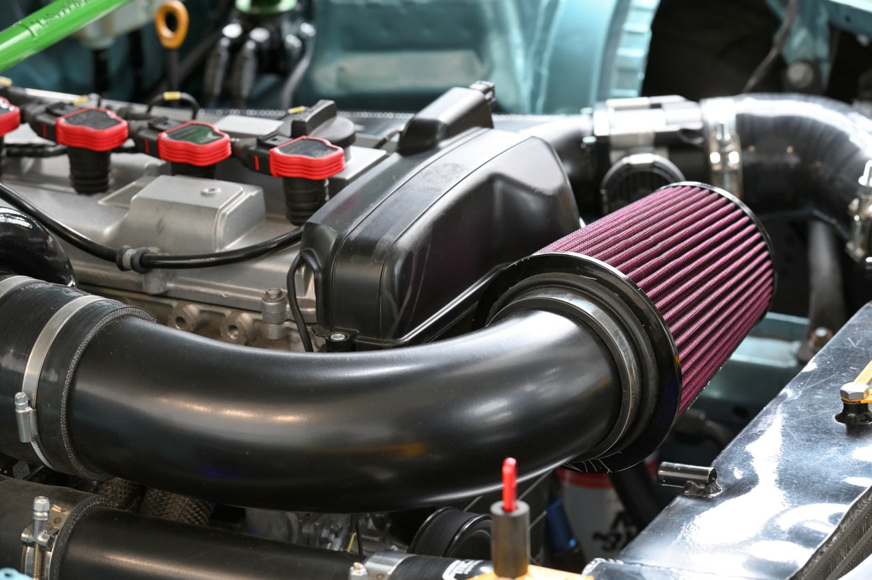 A clean vehicle engine air filter post-installation.