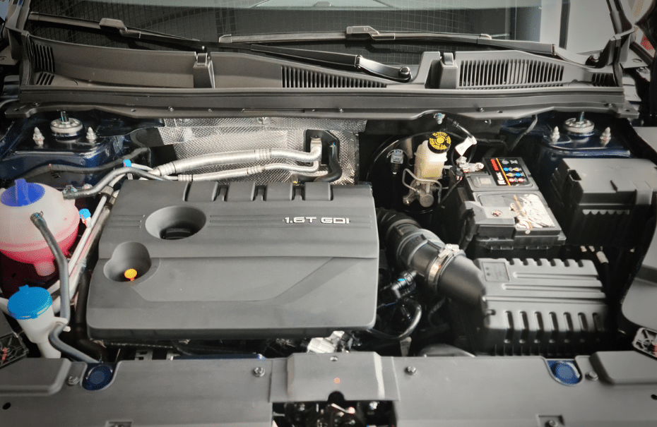 A 1.6T gasoline direct injection (GDI) engine showing fuel delivery components.