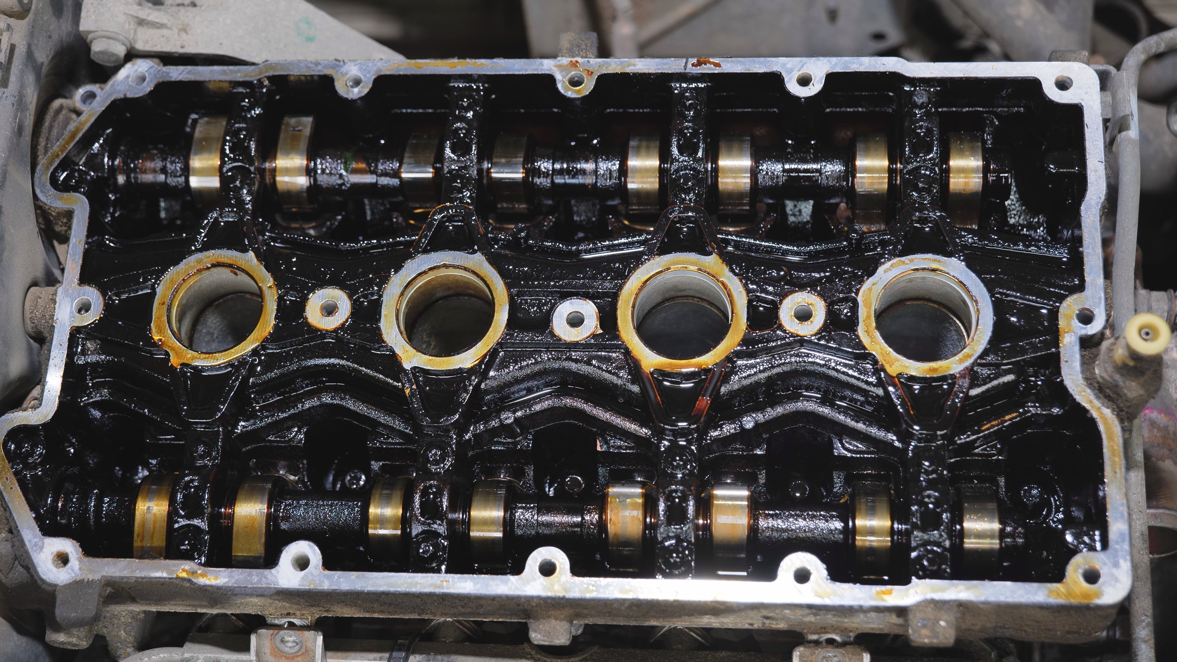 Car engine with sludge and oil waste needing maintenance and repair