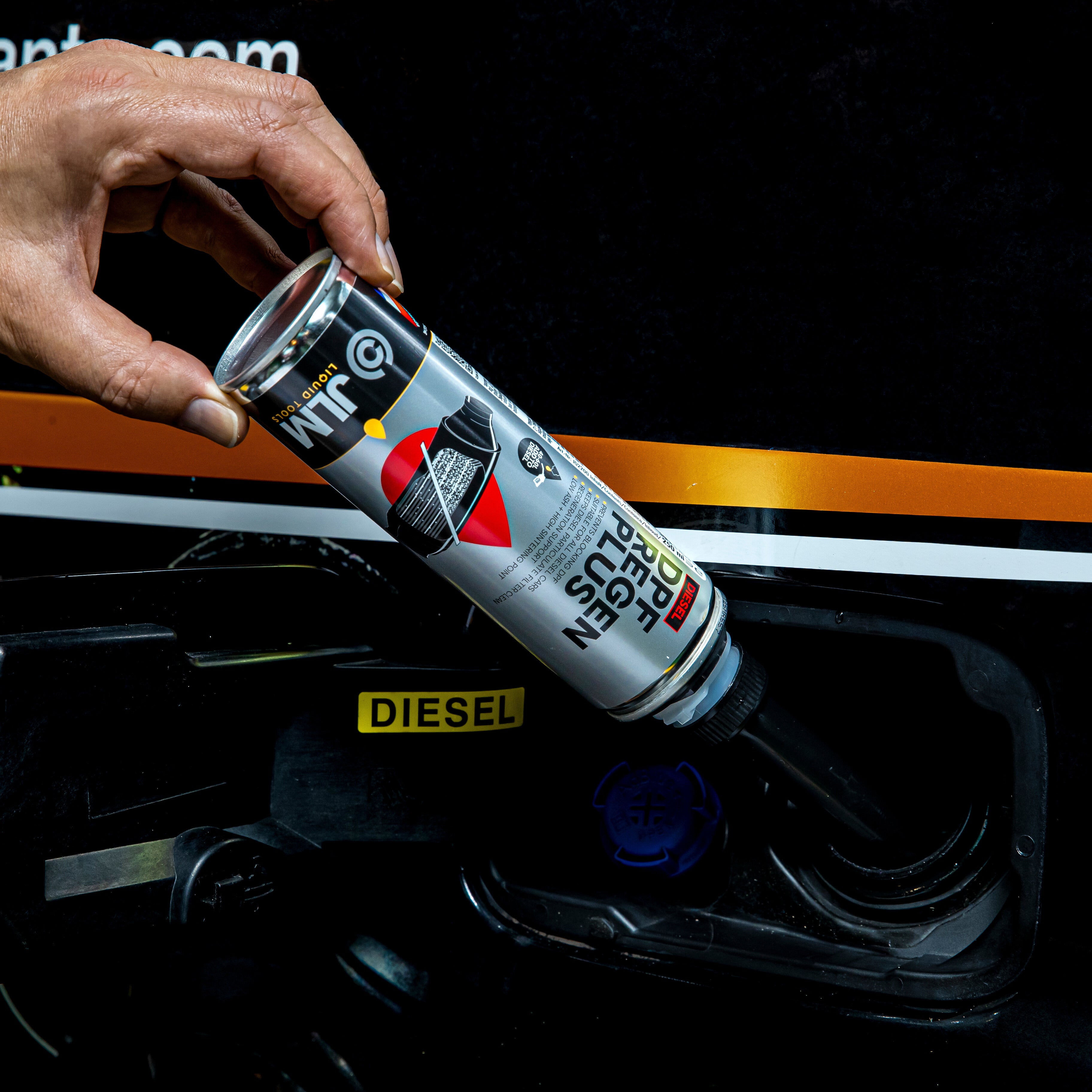 Diesel DPF Regen Plus from JLM Liquid Tools being applied to the fuel tank