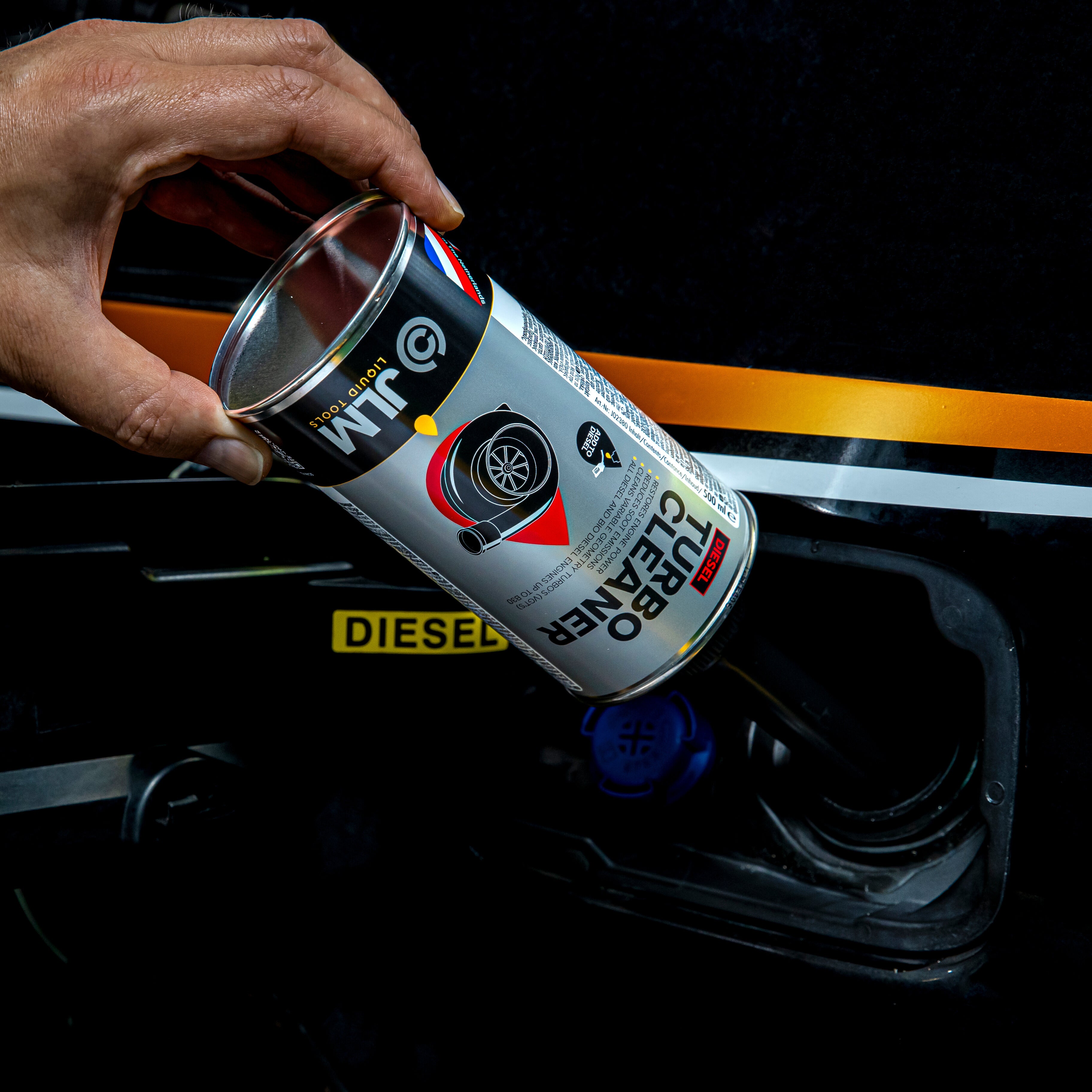 Turbo cleaner from JLM Lubricants being applied to the fuel tank 